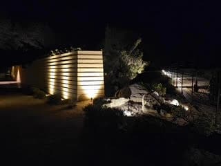 Banded stone wall grazed with light on the rock outcrop