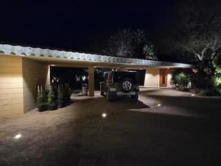 Carport under the long horizontal roofline