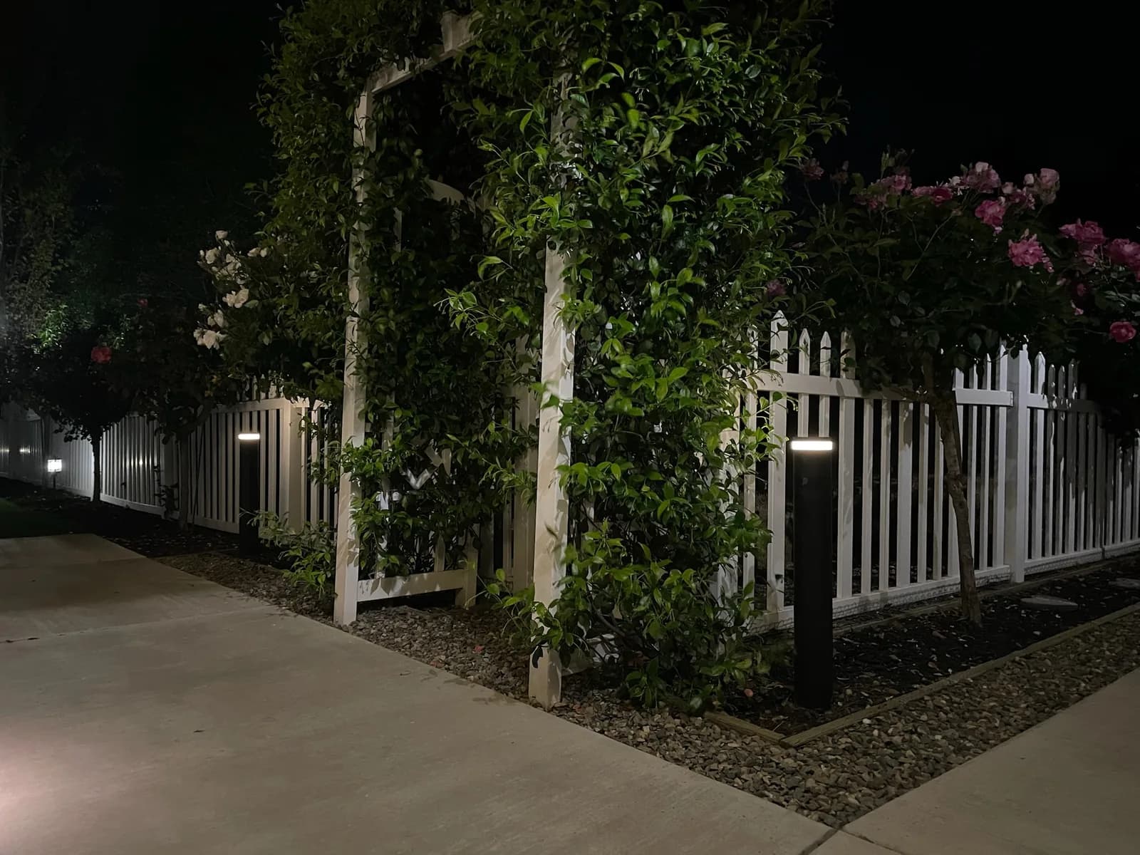 Bollards along a picket fence and walkway