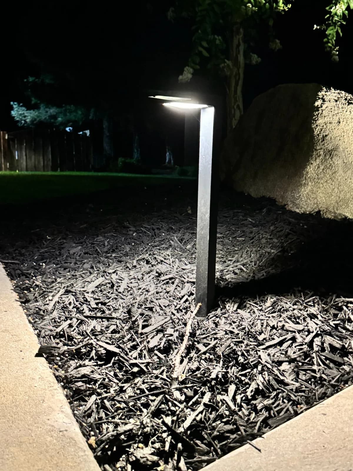 Modern path light over a mulch bed