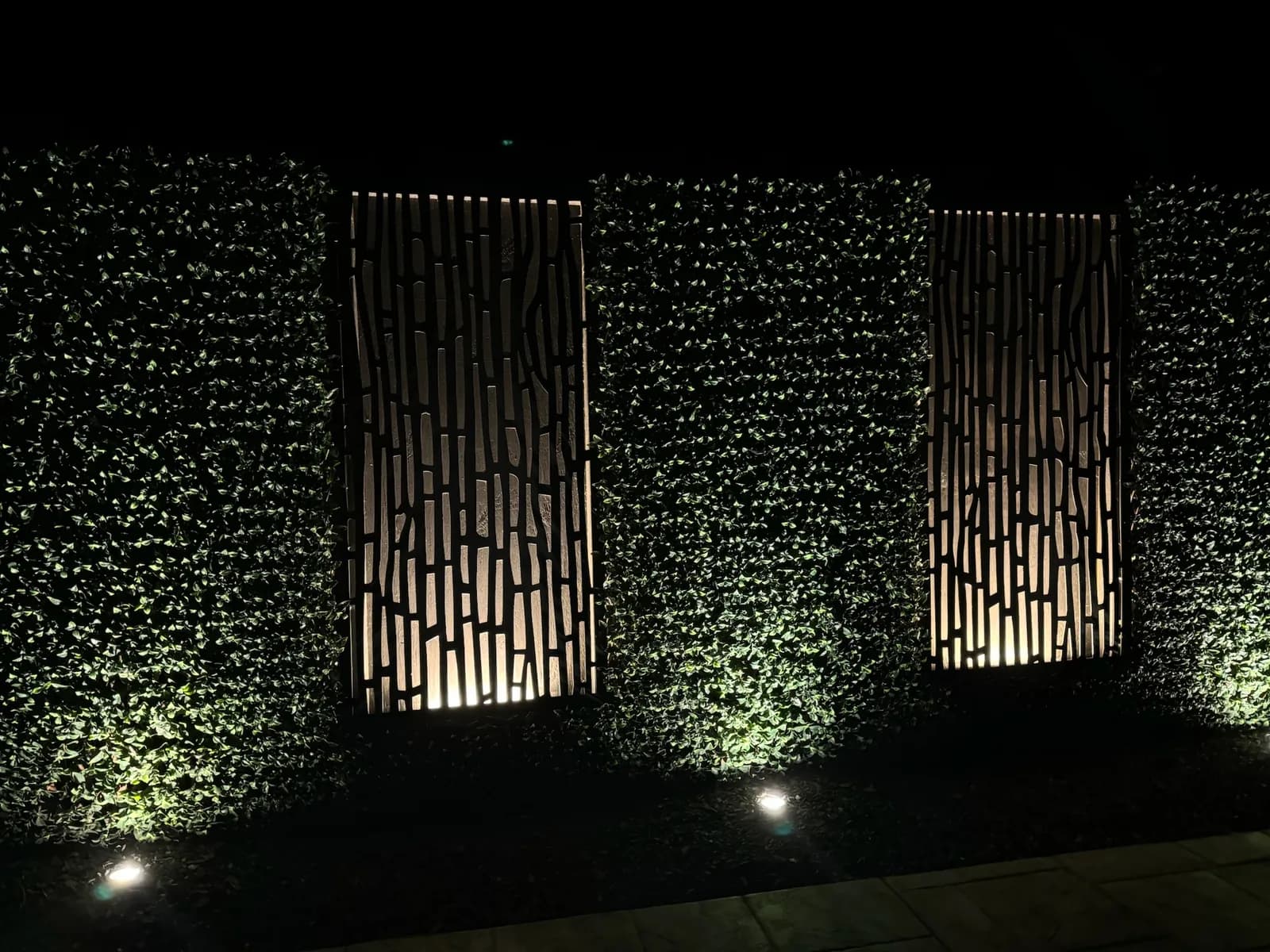 Decorative screens and hedge wall uplit